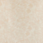 Detail of fabric in an absract paint swatch print in light pink on a cream field.