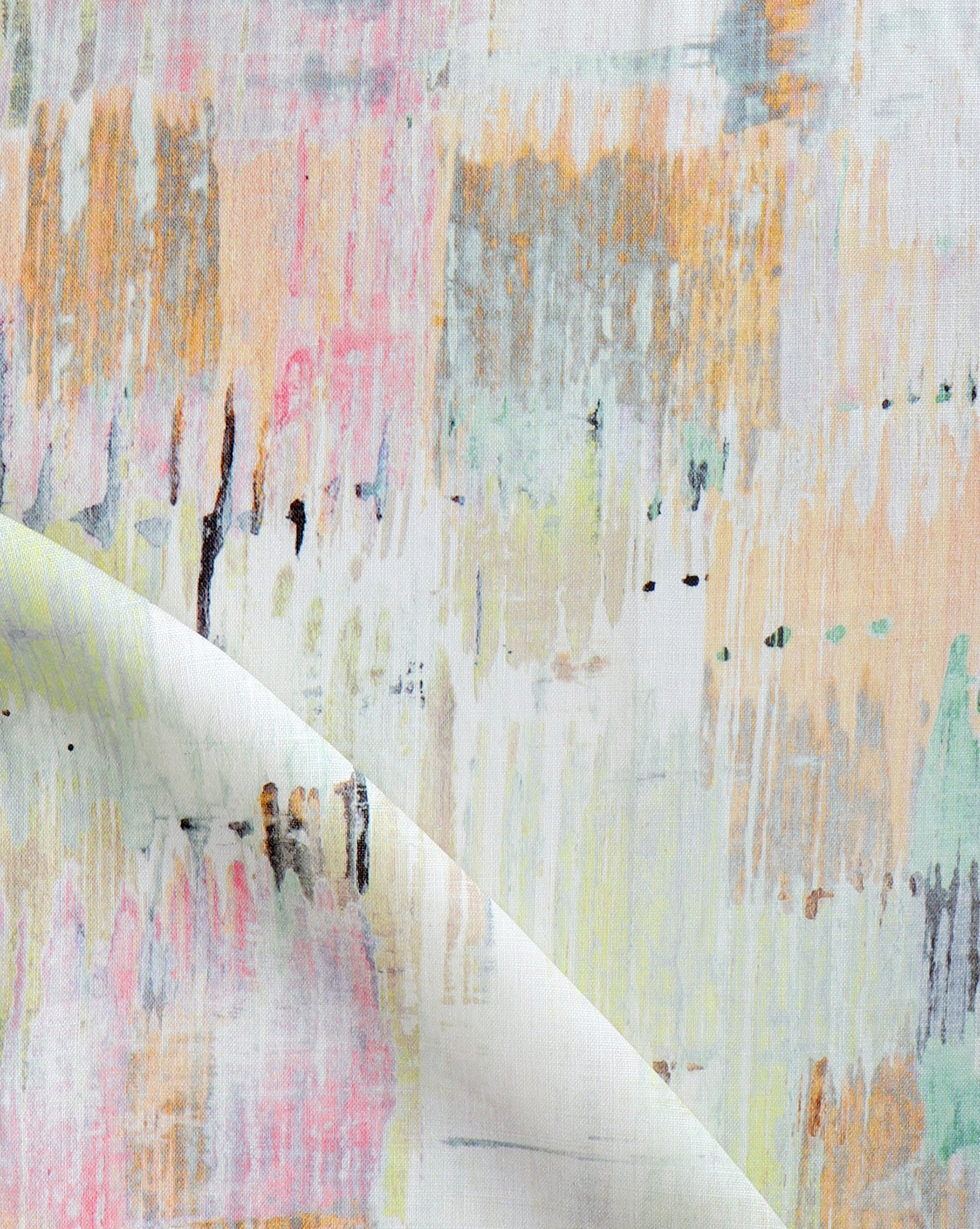 Detail of fabric in a watercolor paint blot print in various pastels on a white field.