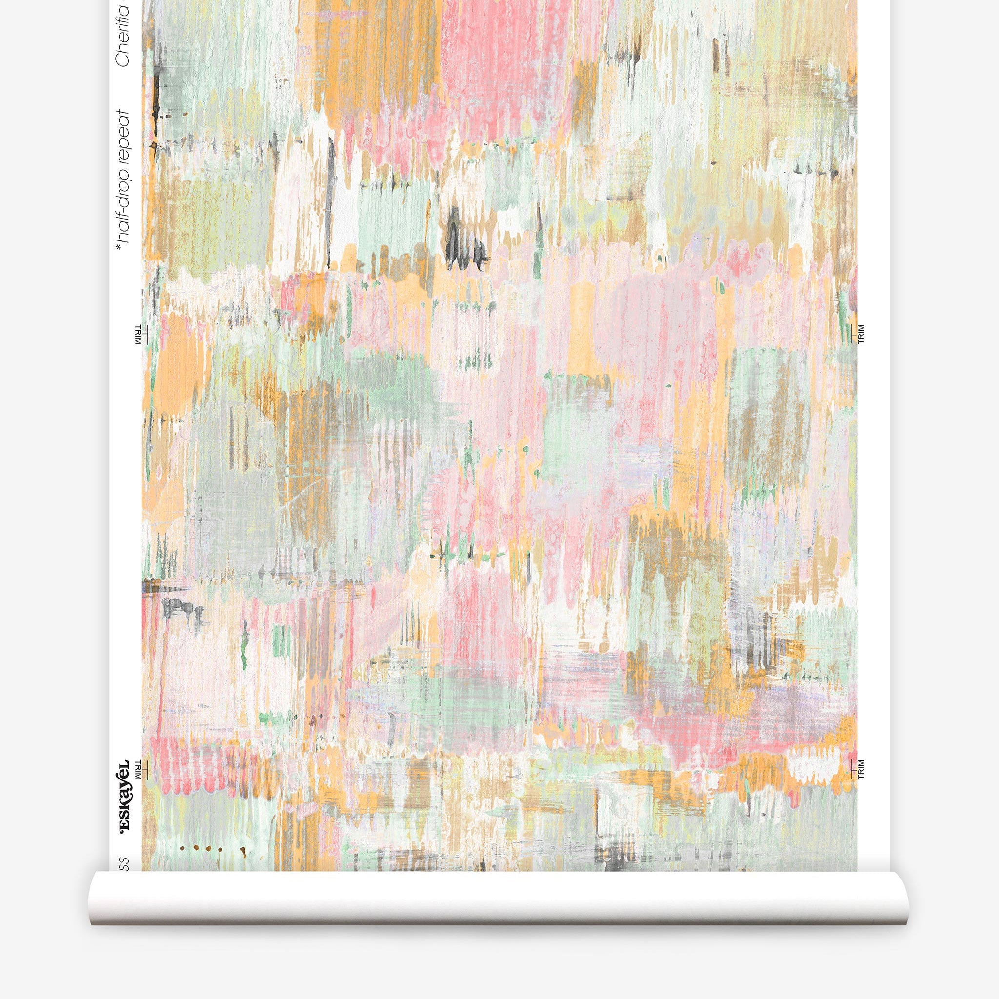 Partially unrolled wallpaper yardage in a watercolor textural print in shades of pink, green, yellow and white.