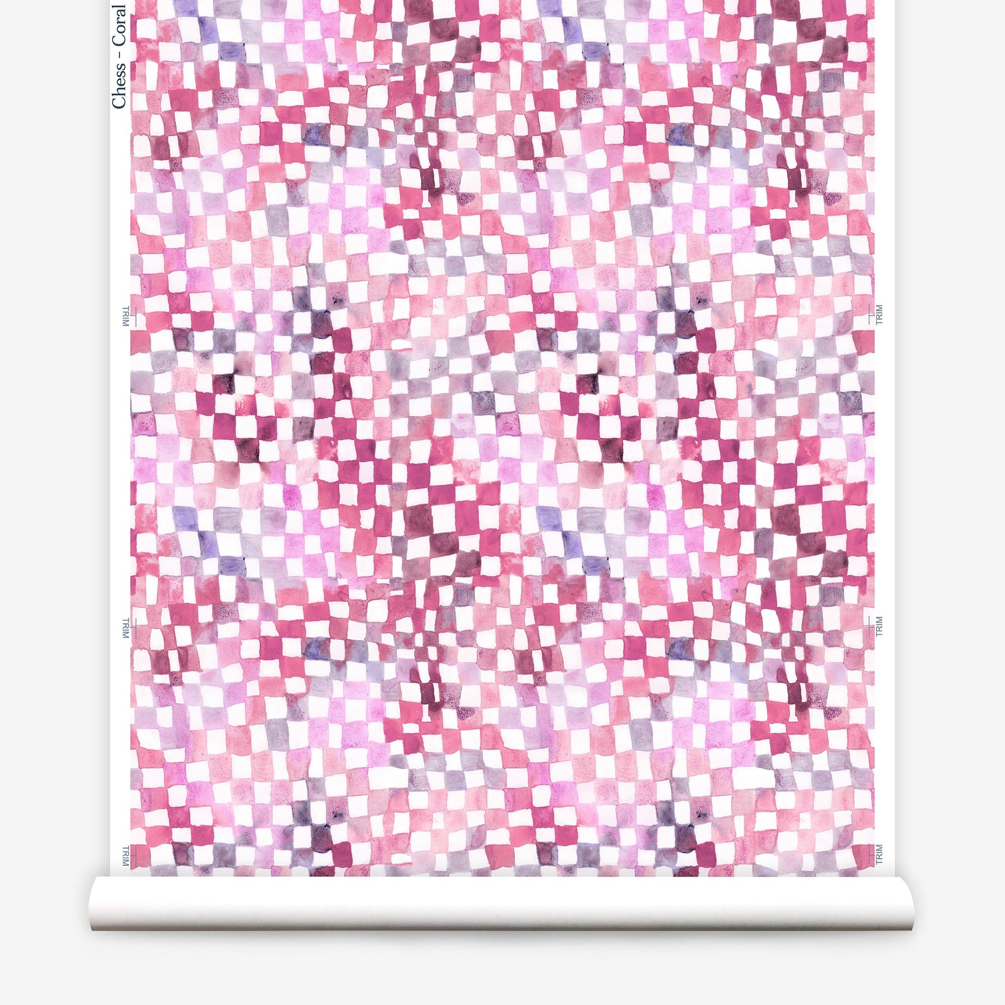 Partially unrolled wallpaper yardage in a painterly chess board print in pink, purple and white.