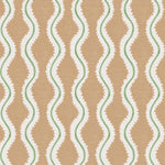 Detail of fabric in a playful curvy stripe print in white and green on a burnt orange field.