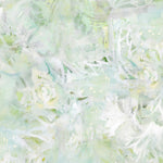 Detail of wallpaper in a watercolor painted print in shades of green, yellow and white.