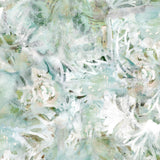 Detail of wallpaper in a watercolor painted print in shades of green, tan and white.