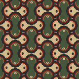 Detail of fabric in an interlocking curvilinear print in shades of green, pink, red and cream.