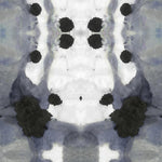 Detail of wallpaper in a watercolor ink blot print in shades of charcoal and gray on a white field.
