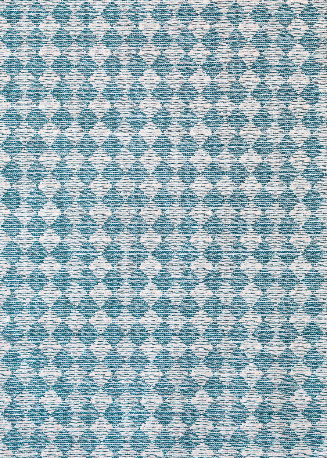 Detail of fabric in a textural diamond print in blue and cream.