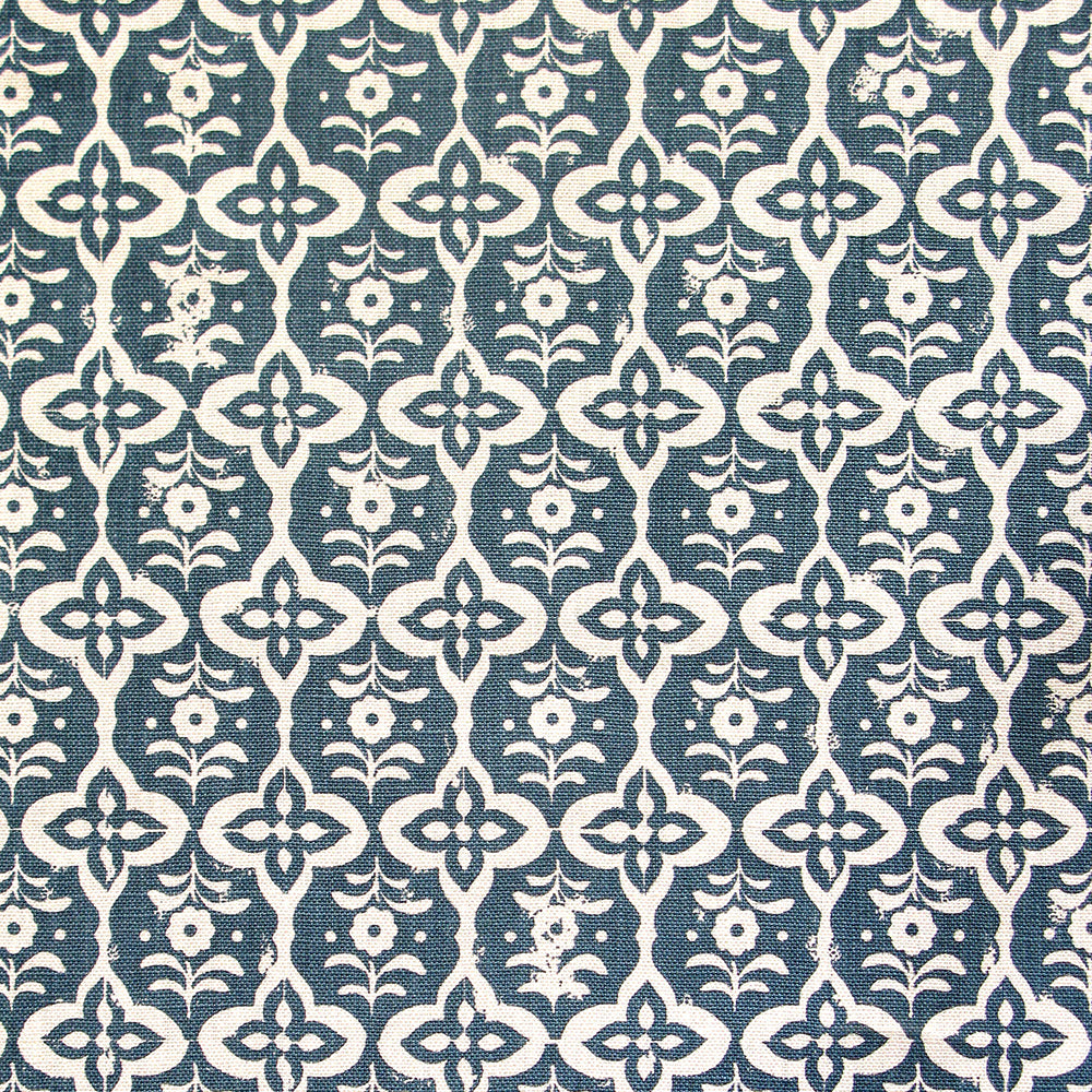 Detail of fabric in a floral grid print in cream on a navy field.