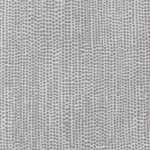 Detail of fabric in a painterly dotted print in gray on a light gray field.