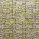 Detail of fabric in a textural grid print in mustard and tan on a light gray field.