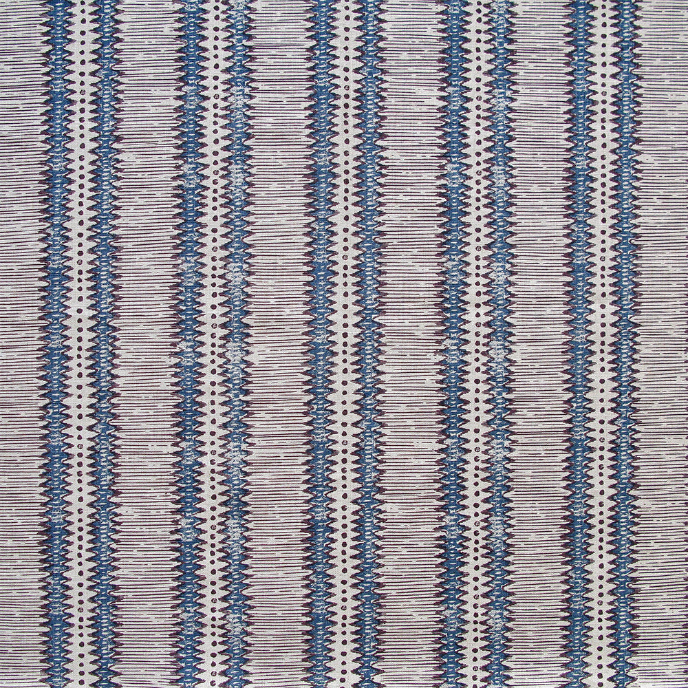Detail of fabric in a dense tribal stripe pattern in shades of greige, brown and navy.