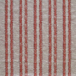 Detail of fabric in a dense tribal stripe pattern in shades of gray and red.