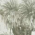 Close-up of fabric in a painterly tree print in sage on a white field.