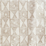 Close-up of fabric in a geometric grid print in tan on a white field.