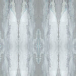 Detail of wallpaper in a watercolor textural print in shades of gray and blue-gray.