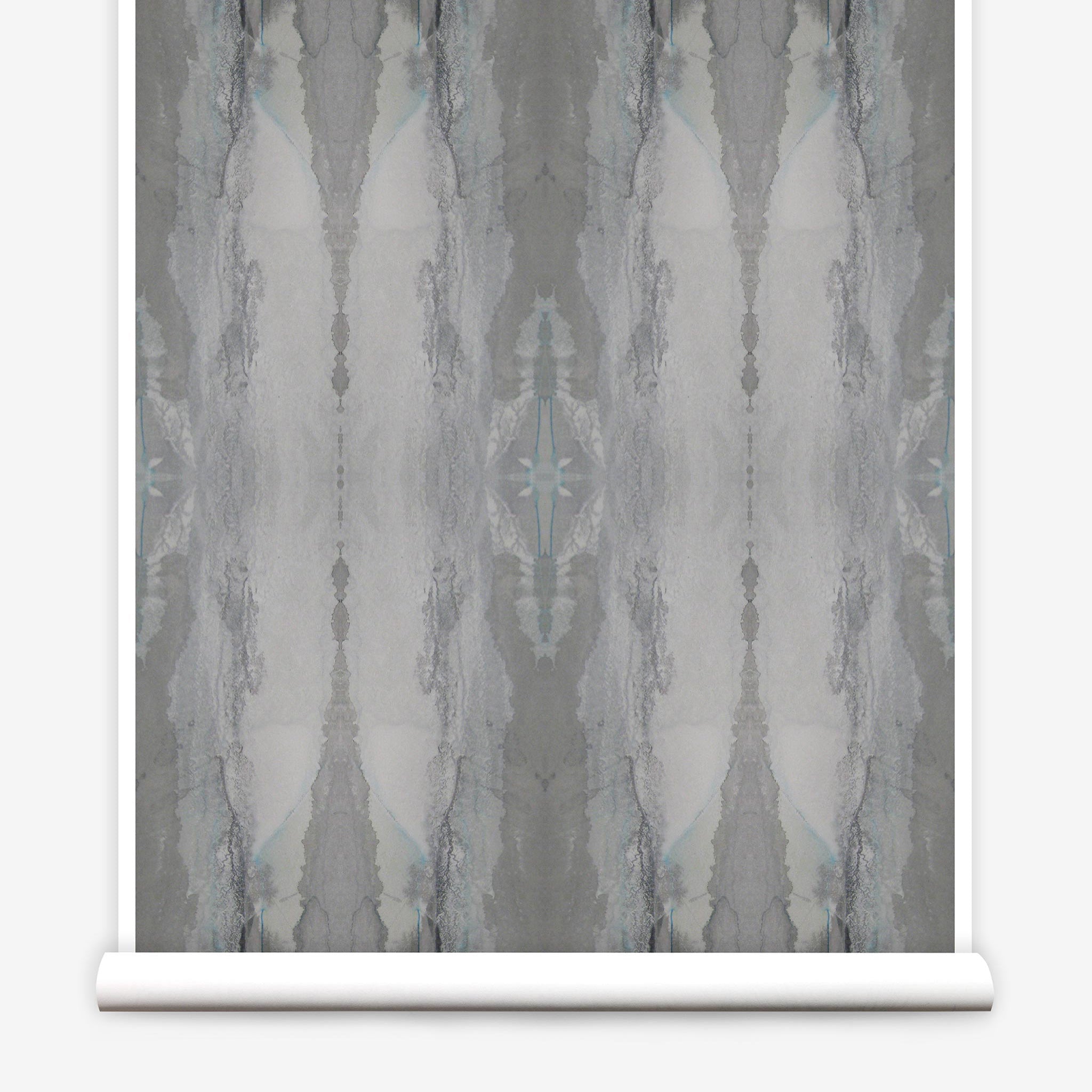 Partially unrolled wallpaper yardage in a watercolor textural print in shades of gray.