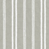 Detail of wallpaper in a textural stripe pattern in white on a greige field.