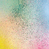 Detail of fabric in an abstract ombré paint splatter print in shades of yellow, pink, green and blue.