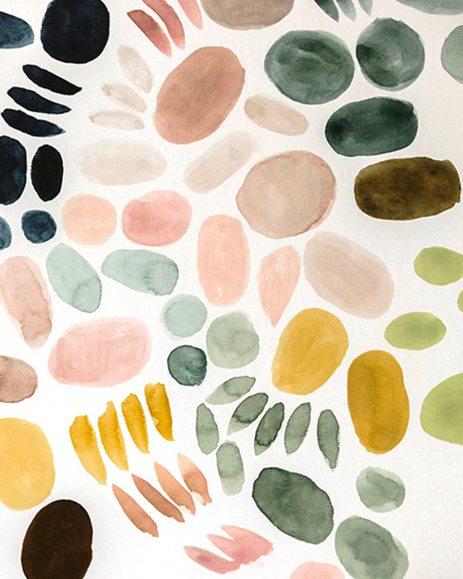 Detail of wallpaper in a playful paint blotch print in shades of green, pink and yellow on a white field.