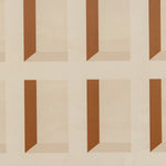 Detail of wallpaper in a dimensional grid print in shades of cream and rust.