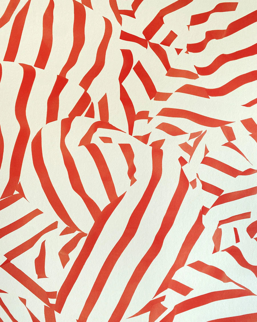 Detail of wallpaper in a playful broken stripe print in red on a cream field.