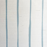 Detail of fabric in a playful irregular stripe print in blue on a cream field.
