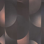Detail of wallpaper in an abstract curvilinear print in mottled black, pink and cream.