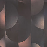 Detail of wallpaper in an abstract curvilinear print in mottled black, pink and cream.