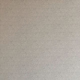 Detail of wallpaper in a painterly leaf print in black on a greige field.
