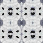 Detail of wallpaper in a watercolor ink blot print in shades of charcoal and black on a greige field.