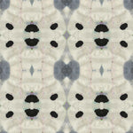 Detail of wallpaper in a watercolor ink blot print in shades of charcoal and black on a greige field.