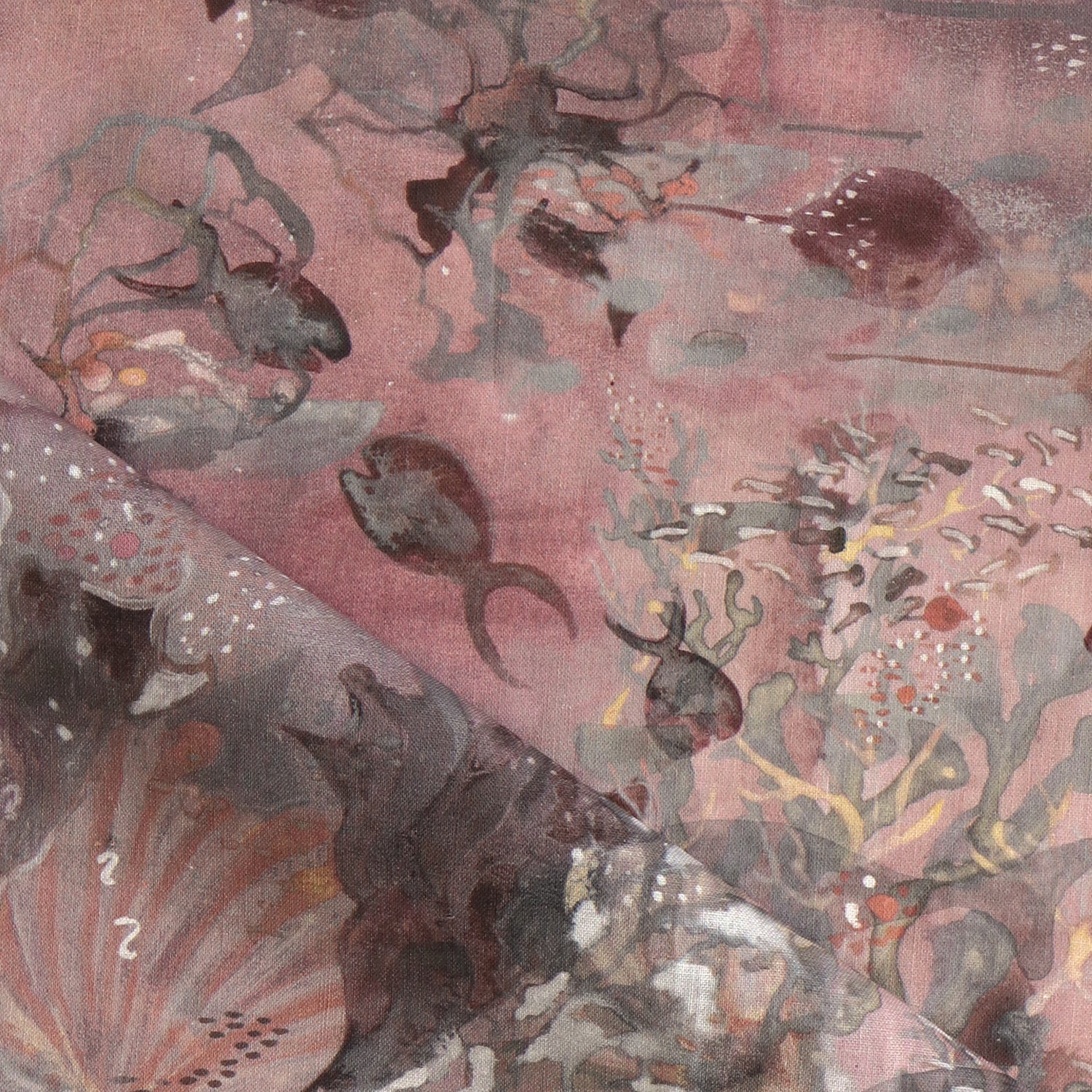 Draped fabric in an underwater sealife scene in shades of warm blush and grey. 