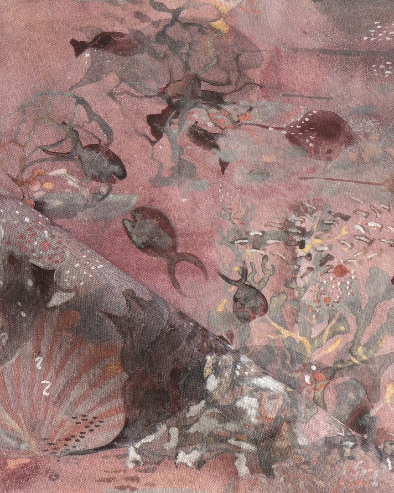 Draped fabric in an underwater sealife scene in shades of warm blush and grey. 