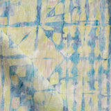 Detail of draped fabric in a watercolor dyed grid print in mottled yellow, blue and white.