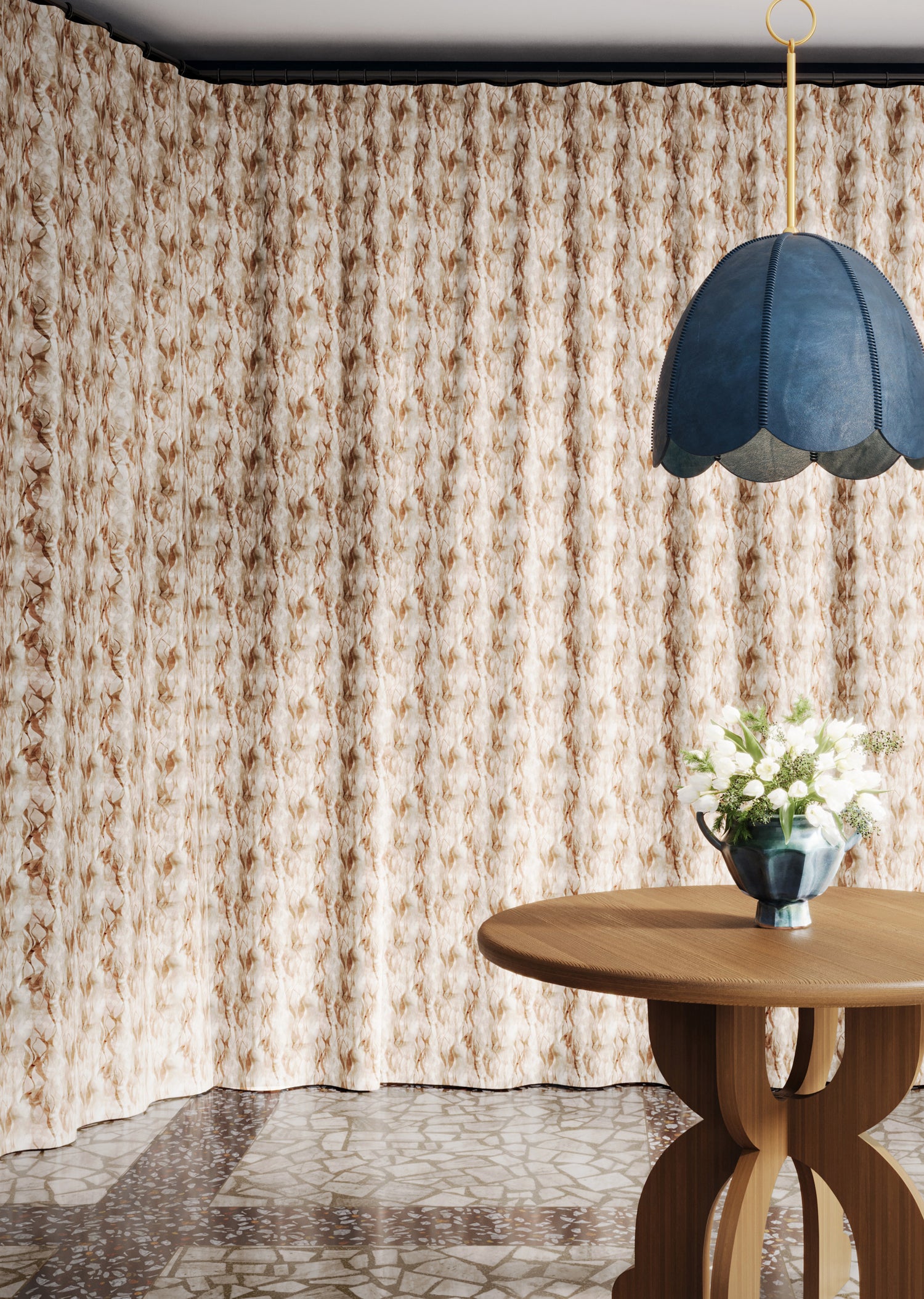 Floor length curtain in watercolor brown pattern with a wooden table with flowers and blue pendant lamp. 