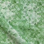 Patterned watercolor lace fabric in green