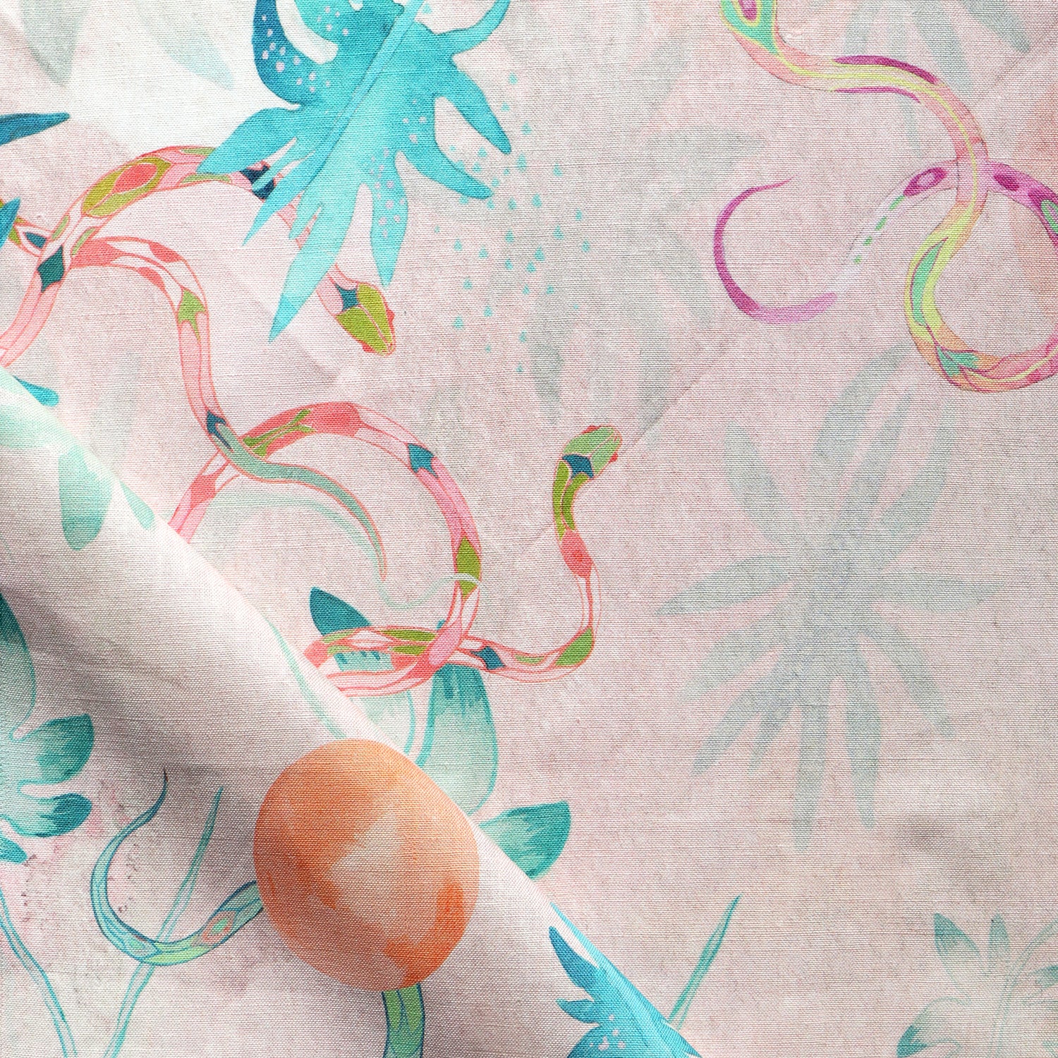 Detail of draped fabric in a playful leaf and snake print in turquoise, pink and green on a coral field.