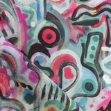 Draped fabric in abstract brushstroke design in shades of pink, turquoise, green, blue, yellow and black accents. 