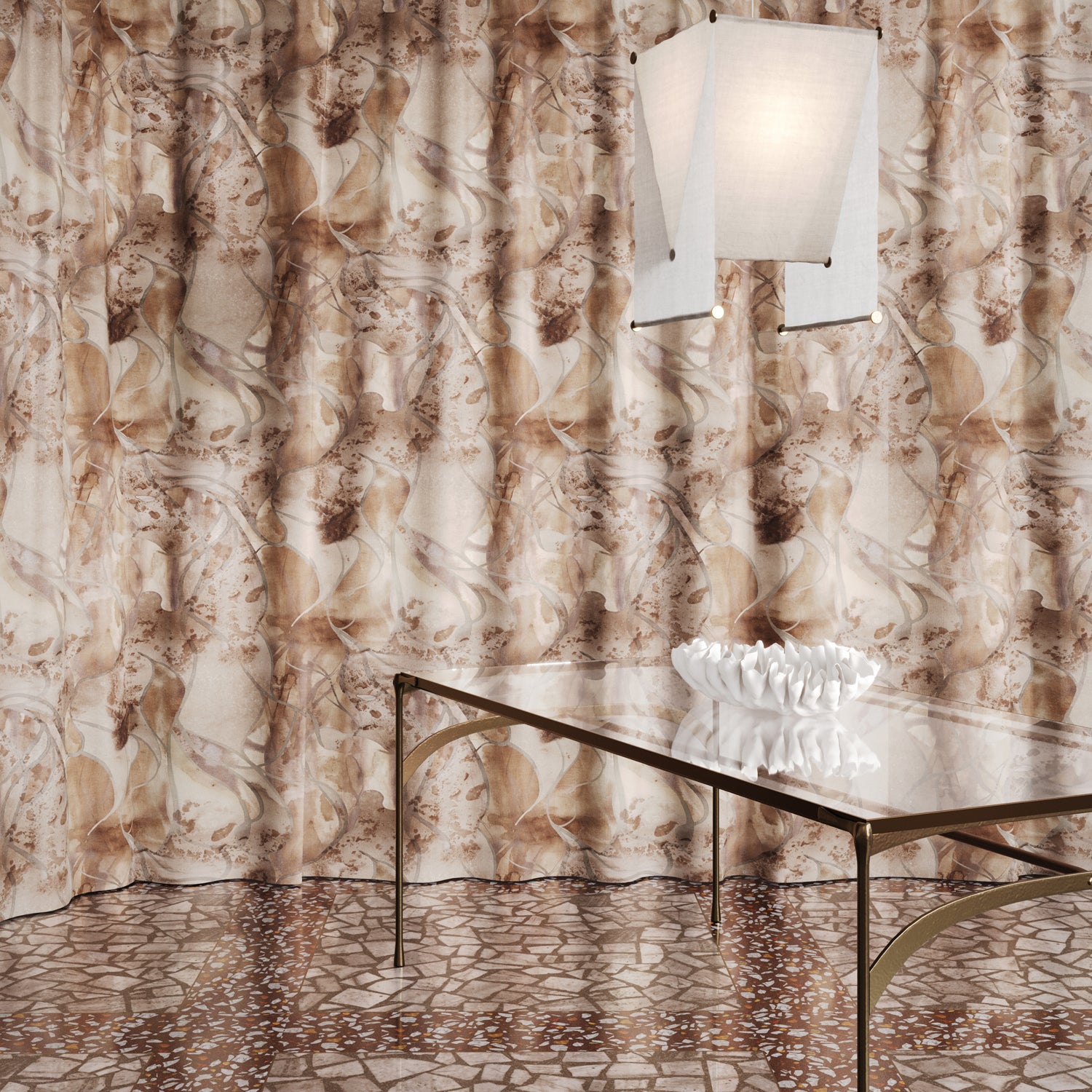 Floor length curtain in  abstract floral bushstroke design in soft brown with grey with a metal and glass table. 