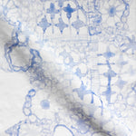 Textile with blue floral pattern on a white background