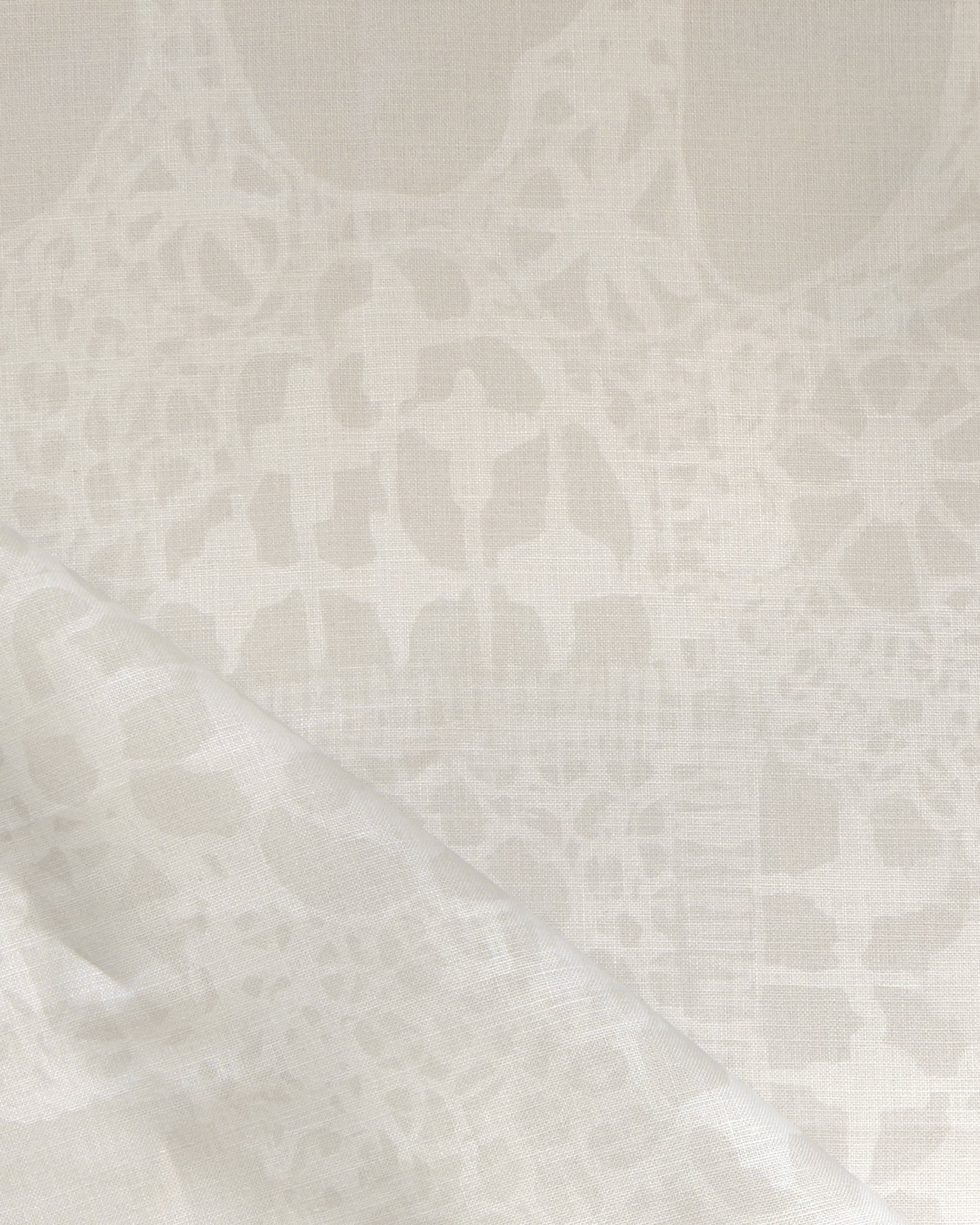 Close-up of a watercolor lace design in soft beige. 