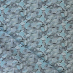 Draped fabric in an undulating abstract watercolor motif in shades of steel blue and charcoal. 