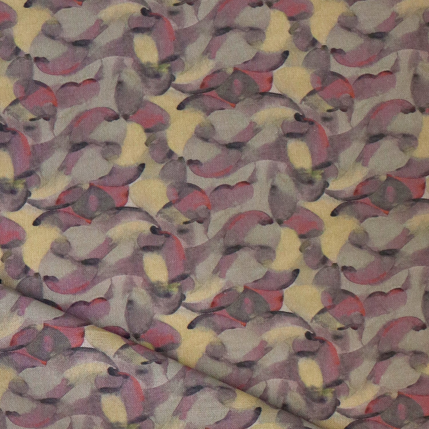 Draped fabric in an undulating abstract watercolor motif in purple, taupe, yellow and charcoal. 