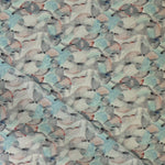 Draped fabric in an undulating abstract watercolor motif in sage green, grey and brown. 