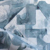 Draped fabric in a geometric puzzle piece watercolor pattern in shandes of slate blue. 