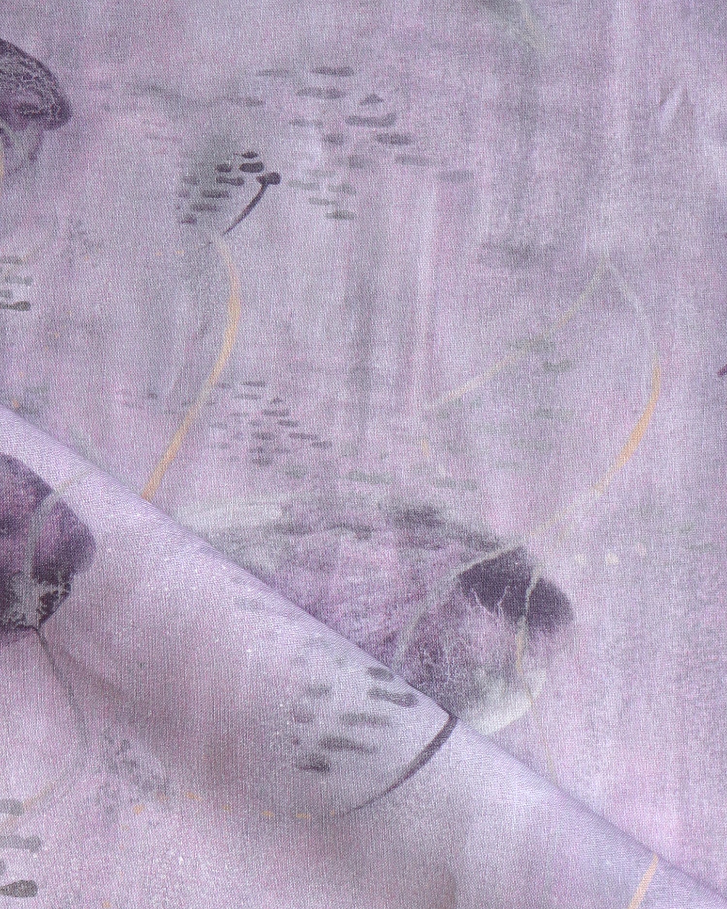 Draped fabric in an watercolor oceanic fish pattern light purple. 