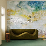 Living room with modernist couch and lamp against ethereal watercolor mural in blue, grey, yellow and grey. 