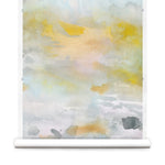 Wallpaper roll of an ethereal watercolor mural in shades of blue, green, yellow and grey. 