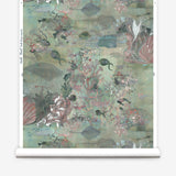 Wallpaper roll in an underwater sealife scene in shades of sage green with coral accents. 