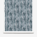 Draped fabric in a layered squiggle watercolor pattern in shades of steel blue. 