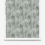 Wallpaper roll in a layered squiggle watercolor pattern in shades of muted teal. 